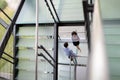 Young business people climb the stairs in the office Royalty Free Stock Photo