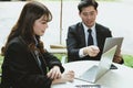 young business people having a meeting. businessman & businesswoman working with computer at cafe. startup man & freelance woman Royalty Free Stock Photo