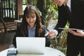 young business people having a meeting. businessman & businesswoman working with computer at cafe. startup man & freelance woman Royalty Free Stock Photo