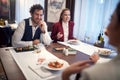 Young business people having a nice talk during a lunch at the restaurant. Business, restaurant, lunch