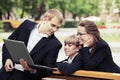 Young business people with laptop in city park Royalty Free Stock Photo