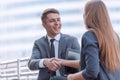 Young business people shaking hands at an informal meeting Royalty Free Stock Photo