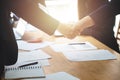 Young business people shaking hands in the office. Finishing successful meeting. Business executives to congratulate the joint Royalty Free Stock Photo