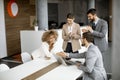 Group of young business people making a deal at a meeting in the office Royalty Free Stock Photo