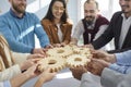 Business people hands connecting gear cog, concept of coopertation teamwork unity