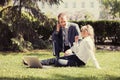 Young business people using laptop in city park Royalty Free Stock Photo