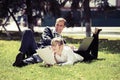 Young business people using laptop in a city park Royalty Free Stock Photo