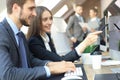 Young business people working on their desktop computers at the modern office space Royalty Free Stock Photo