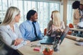 Young business people working together in creative office. Selective focus Royalty Free Stock Photo