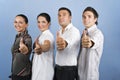 Young business team giving thumbs up Royalty Free Stock Photo