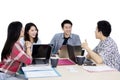 Young business team having a discussion on studio Royalty Free Stock Photo