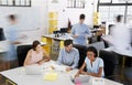 Young business team having a meeting in a busy office Royalty Free Stock Photo