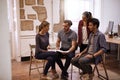 Young business team looking at speaker