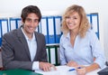 Young business team at office laughing at camera Royalty Free Stock Photo