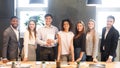 Young business team smiling to camera, having break Royalty Free Stock Photo