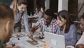 Young business team working at office. Mixed race group of people discussing the architectural design for house together Royalty Free Stock Photo