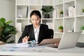 Young business woman asian or employee accounting bookkeeping documents checking financial data or marketing report Royalty Free Stock Photo