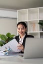Young business woman asian or employee accounting bookkeeping documents checking financial data or marketing report Royalty Free Stock Photo