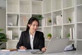 Young business woman asian or employee accounting bookkeeping documents checking financial data or marketing report Royalty Free Stock Photo