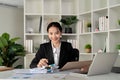 Young business woman asian or employee accounting bookkeeping documents checking financial data or marketing report Royalty Free Stock Photo