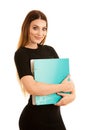 Young business woman in black dress holds a folder isolated over Royalty Free Stock Photo