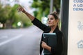 Young business woman calling a taxi on the street Royalty Free Stock Photo