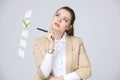 Young business woman checking on checklist box. Gray background. Royalty Free Stock Photo