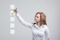 Young business woman checking on checklist box. Gray background. Royalty Free Stock Photo