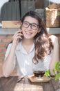 Young business woman cheerful smile sitting at terrace cafe, enjoying online communication using free wireless internet connection Royalty Free Stock Photo