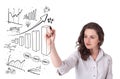 Young business woman drawing diagrams on whiteboard Royalty Free Stock Photo