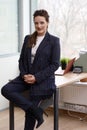 Young business woman dressed in elegant style