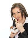 Young Business Woman Eating a Bowl of Cereals with Yogurt and Be Royalty Free Stock Photo