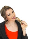 Young Business Woman Eating a Breakfast Cereal Bar Royalty Free Stock Photo