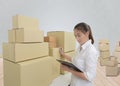 Young business woman, entrepreneur holding clipboard, check the product, smile and laugh happily at work office Royalty Free Stock Photo