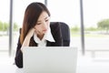 Young business woman exhausted and bored in the office