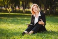 Young business woman with a folder in a city park Royalty Free Stock Photo