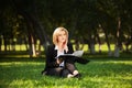 Young business woman with a folder on nature Royalty Free Stock Photo