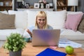 Young business woman freelance expatriate financial and digital marketing expert in smart casual working at home in home office Royalty Free Stock Photo