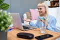 Young business woman freelance expatriate financial and digital marketing expert in smart casual working at home in home office Royalty Free Stock Photo