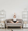 Young business woman freelancer or ceo employee doing yoga exercise at workplace, happy female secretary meditating at Royalty Free Stock Photo