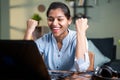 Young business woman got overjoyed by good news and started celebrating while working on laptop - Concept of new Job offer or