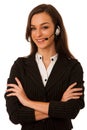 Young business woman with headset isolated over white background Royalty Free Stock Photo