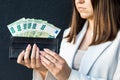 Young business woman holding black wallet with euro banknotes, close up of female hands with cash. The concept of cash payments, Royalty Free Stock Photo