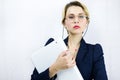 Young business woman holding a file on white background