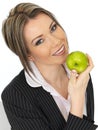 Young Business Woman Holding a Fresh Ripe Juicy Green Apple Royalty Free Stock Photo