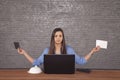 Young business woman is holding two envelopes in her hands Royalty Free Stock Photo