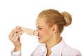 Young business woman with huge clothespin on her nose. Stinks concept