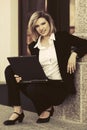 Young business woman with laptop at office building Royalty Free Stock Photo