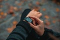 Young business woman is late on time, in a hurry she checks the deadline on her smart watch Royalty Free Stock Photo