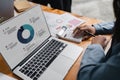 Young business woman looking at computer monitor, analyzing project statistics, marketing research results or statistics Royalty Free Stock Photo